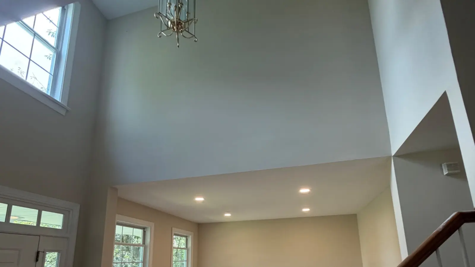 A freshly painted two-story entry and staircase